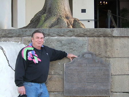 Cort standing by small plaque